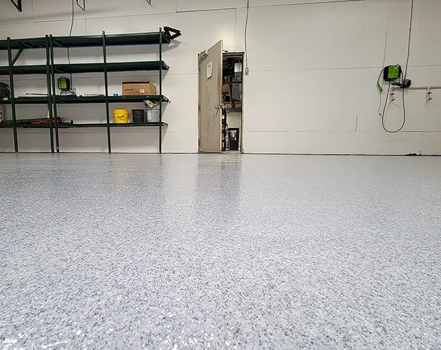 Quartz broadcast system floor with a textured coloured aggregate finish